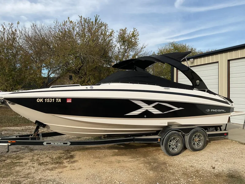 Slide: The Image of 2013 Regal 27 FasDeck RX boat on trailer, side view. - 17