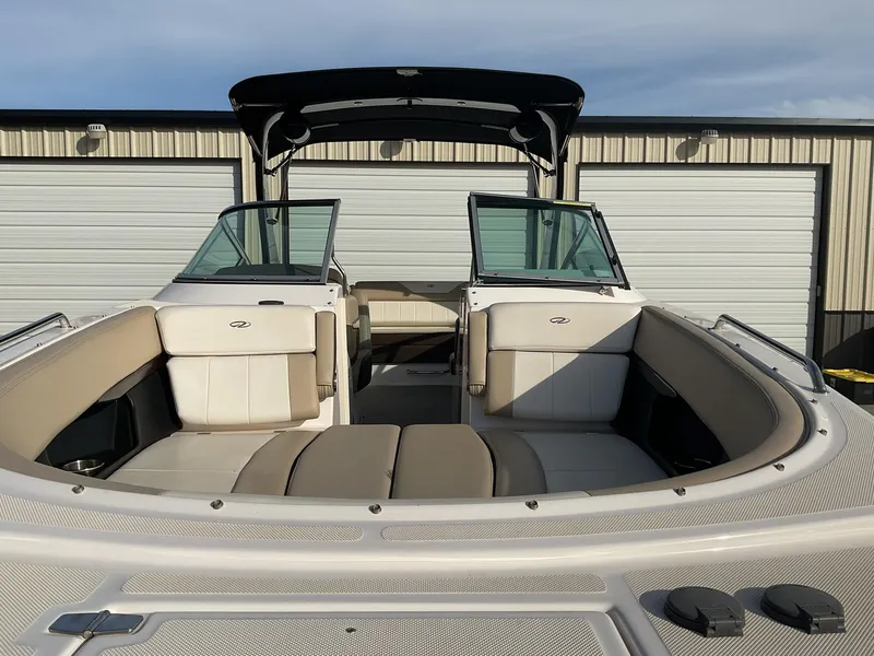 Slide: The Image of 2013 Regal 27 FasDeck RX boat with spacious seating and modern design. - 5