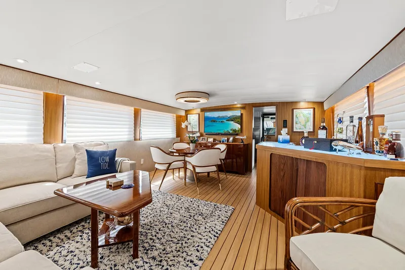 Slide: The Image of Luxurious interior of 1989 Hatteras 70 Motor Yacht with modern furnishings and wooden accents. - 4
