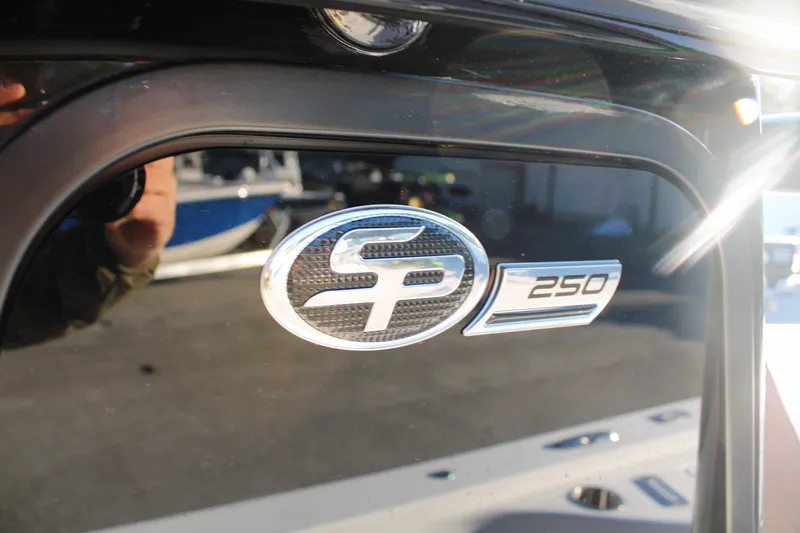 Slide: The Image of 2025 Sea Pro 250 Bay boat logo on a sleek black surface. - 12