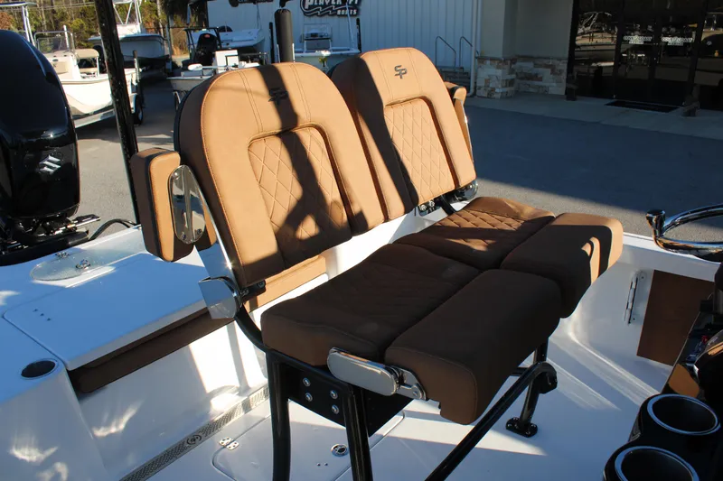 Slide: The Image of 2025 Sea Pro 250 Bay boat with tan cushioned seating, showcasing luxury and comfort. - 14