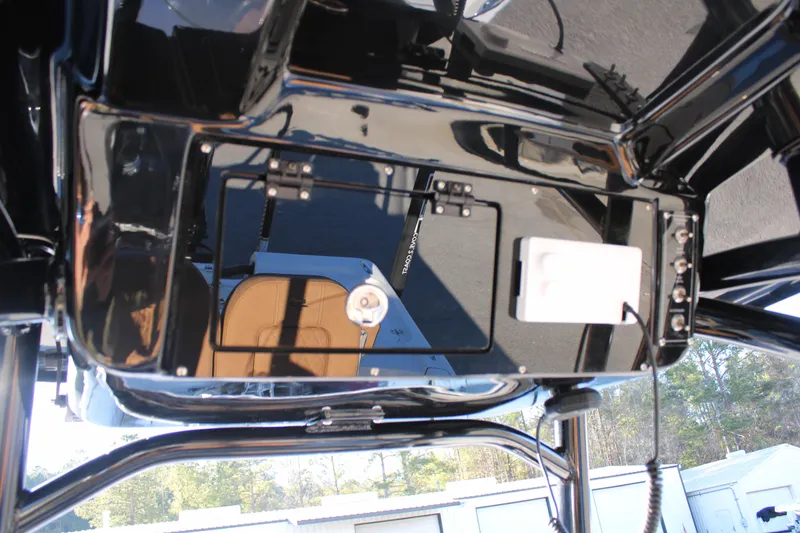 Slide: The Image of 2025 Sea Pro 250 Bay boat console with sleek black finish and modern controls. - 17