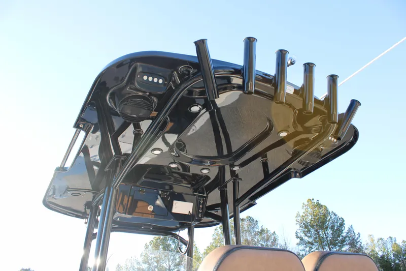 Slide: The Image of T-top of 2025 Sea Pro 250 Bay boat with rod holders and speakers. - 18