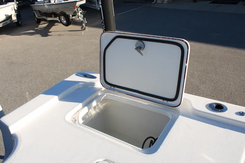 Slide: The Image of 2025 Sea Pro 250 Bay boat storage compartment with open lid. - 20