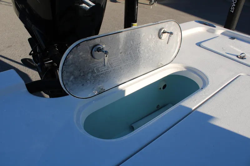 Slide: The Image of 2025 Sea Pro 250 Bay boat with open storage compartment on deck. - 21