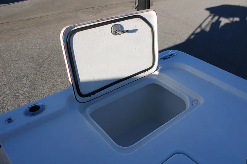 Slide: The Image of Open storage compartment on 2025 Sea Pro 250 Bay boat deck. - 22