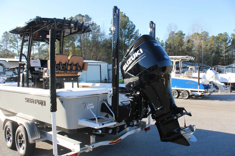 Slide: The Image of 2025 Sea Pro 250 Bay boat with Suzuki outboard motor on a trailer. - 3