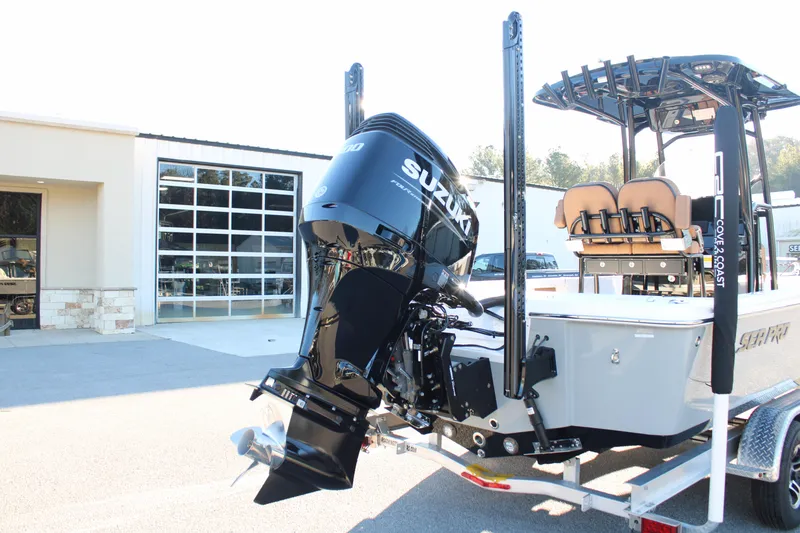 Slide: The Image of 2025 Sea Pro 250 Bay boat with Suzuki outboard motor on trailer. - 4
