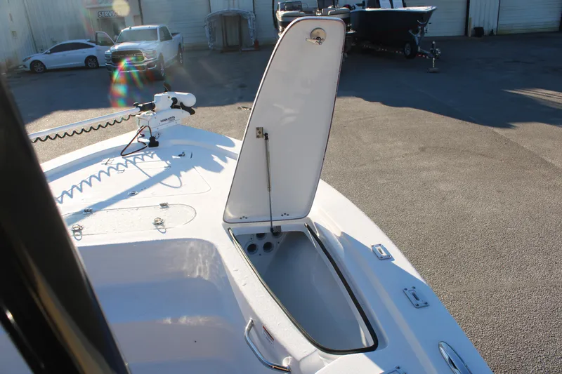 Slide: The Image of 2025 Sea Pro 250 Bay boat with open storage compartment on deck. - 8
