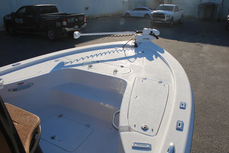 Slide: The Image of 2025 Sea Pro 250 Bay boat with trolling motor in a parking lot. - 9