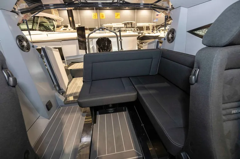 Slide: The Image of 2024 G-Force 8 boat interior with black seating and modern design. - 17