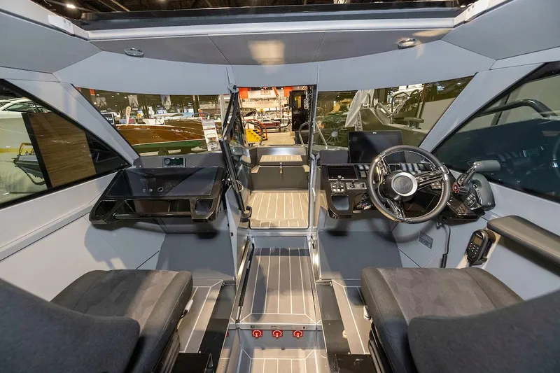 Slide: The Image of Interior of 2024 G-Force 8 boat showcasing modern cockpit and navigation controls. - 18