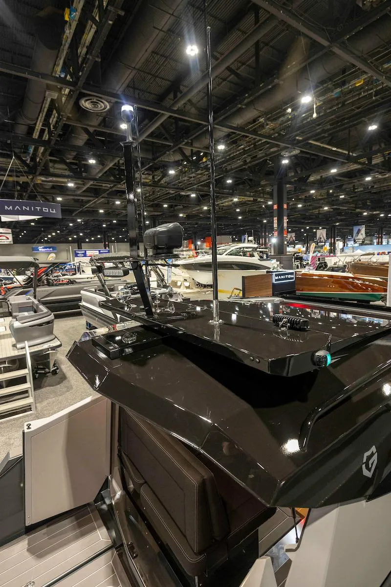Slide: The Image of 2024 G-Force G-Force 8 boat showcased at an indoor exhibition. - 25