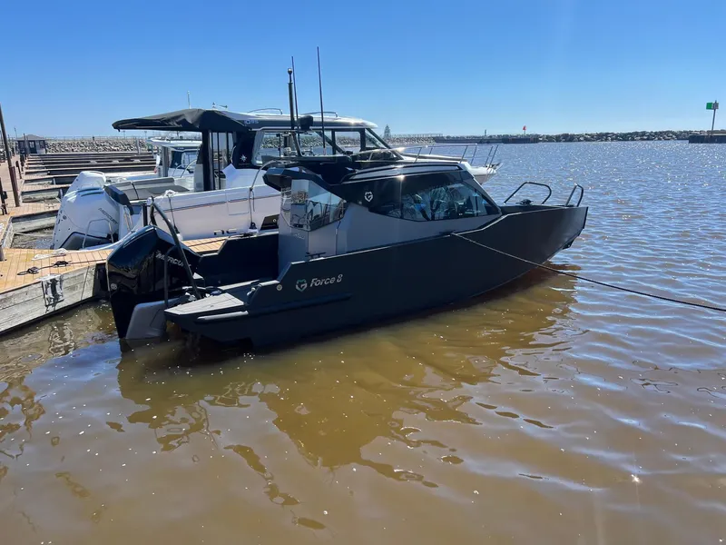 Slide: The Image of 2024 G-Force G-Force 8 boat docked on a sunny day. - 28