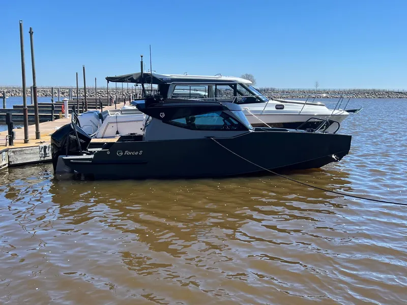 Slide: The Image of 2024 G-Force 8 boat docked at a marina on a sunny day. - 29