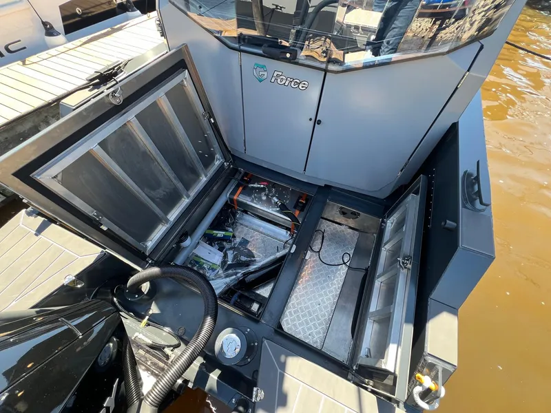 Slide: The Image of 2024 G-Force 8 boat engine compartment with open hatches and visible components. - 31