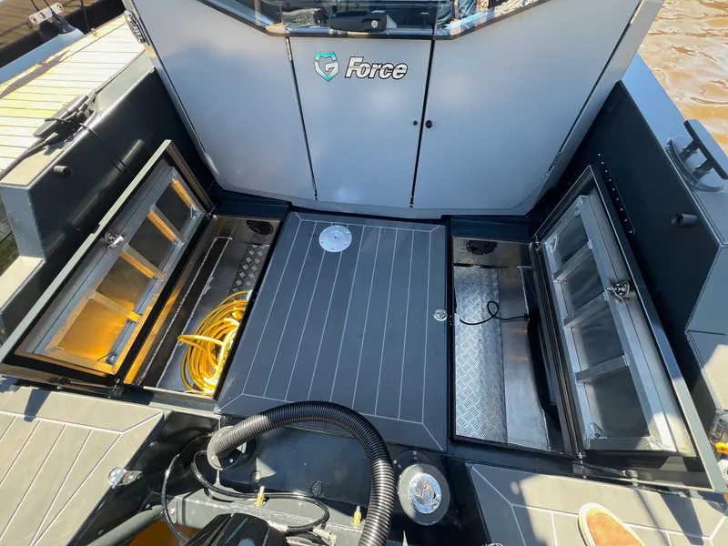 Slide: The Image of 2024 G-Force G-Force 8 boat interior with storage compartments and equipment. - 32