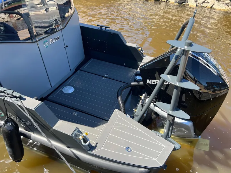 Slide: The Image of 2024 G-Force 8 boat with Mercury outboard engine docked on water. - 33