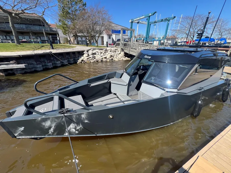 Slide: The Image of 2024 G-Force G-Force 8 boat docked at a marina on a sunny day. - 35