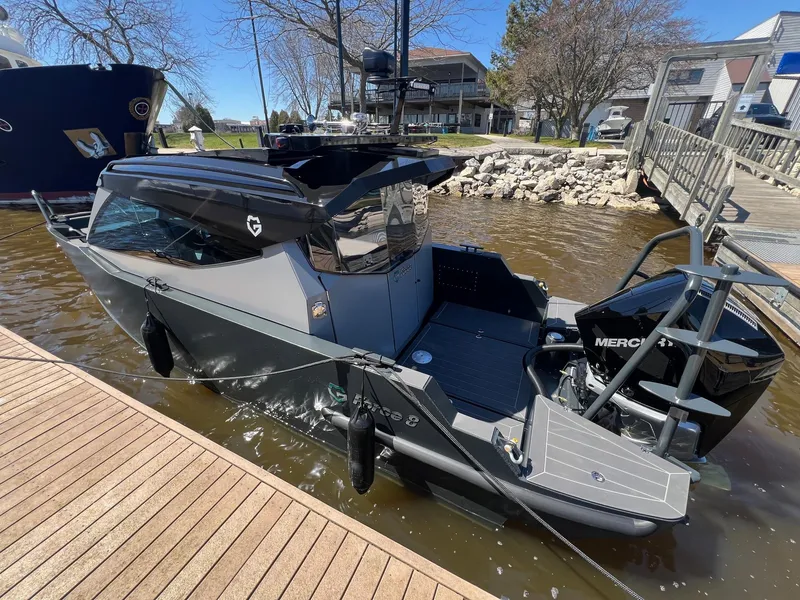 Slide: The Image of 2024 G-Force G-Force 8 boat docked at a marina. - 38