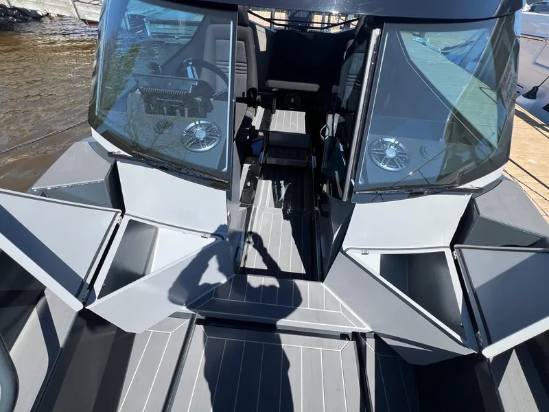 Slide: The Image of 2024 G-Force 8 boat interior with open storage compartments and dual windshields. - 39