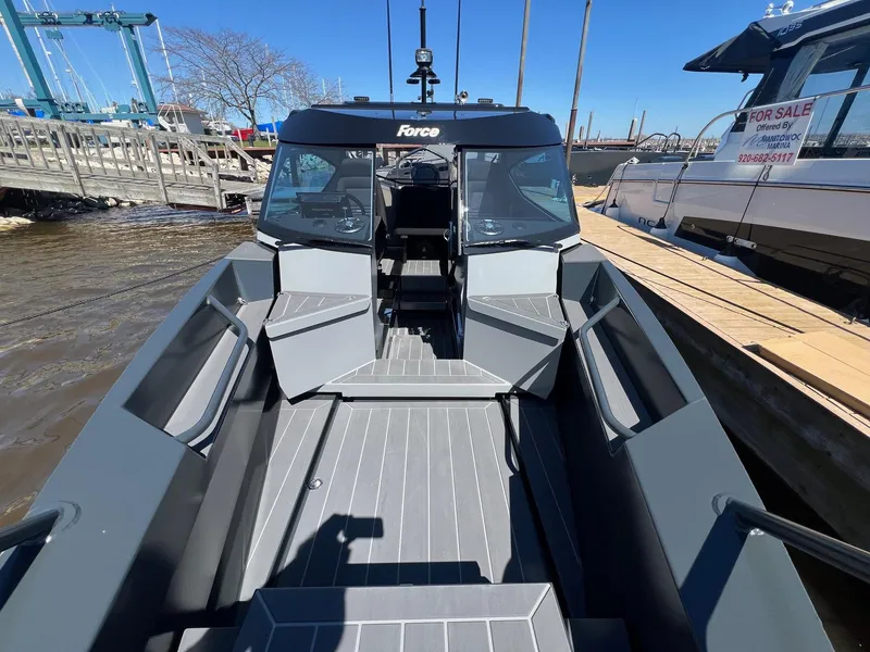 Slide: The Image of 2024 G-Force 8 boat docked, showcasing spacious deck and modern design. - 41