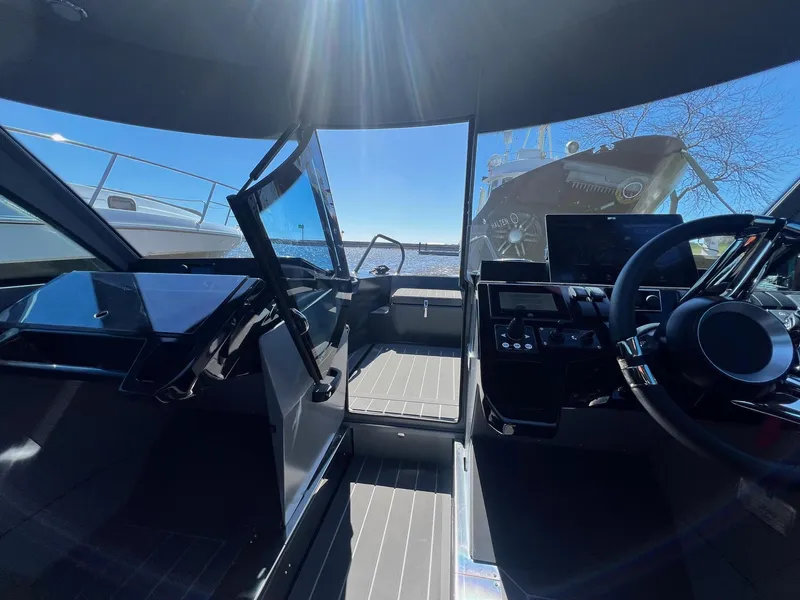 Slide: The Image of Interior cockpit of 2024 G-Force 8 boat with modern controls and steering wheel. - 43
