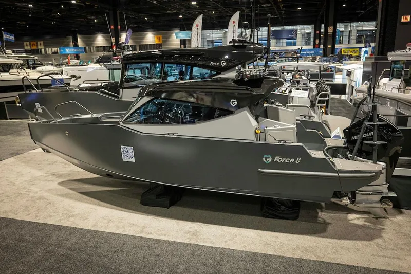 Slide: The Image of 2024 G-Force 8 boat showcased at an indoor boat exhibition. - 5