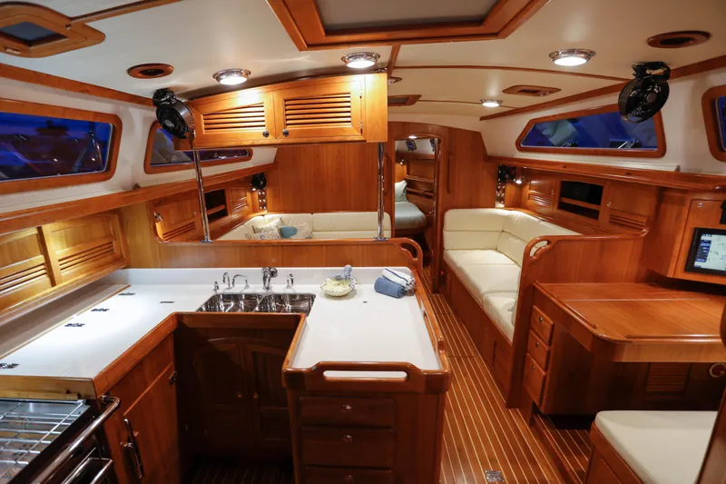 Slide: The Image of Luxurious interior of 2025 Outbound 46 yacht with wooden finishes and modern amenities. - 14