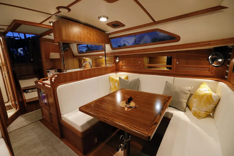 Slide: The Image of Luxurious interior of 2025 Outbound 46 yacht with elegant wood finish and cozy seating. - 18