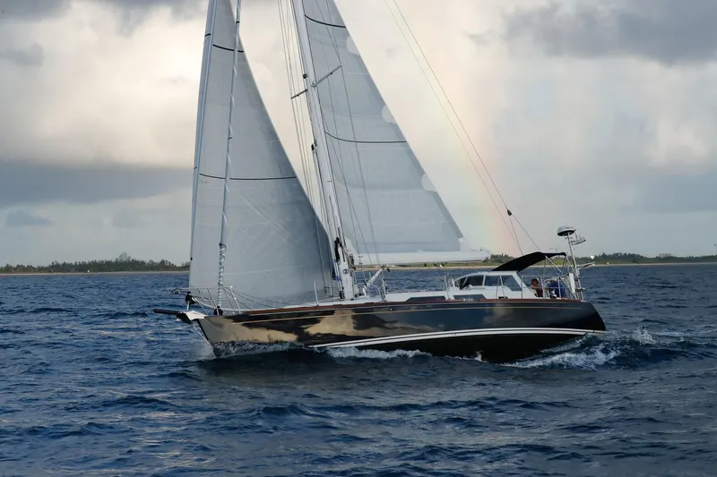 Slide: The Image of Sailing yacht Outbound 46, 2025 model, navigating ocean waters under cloudy skies. - 9