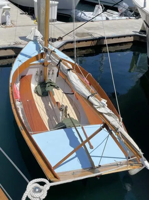 Slide: The Image of Custom Haven 12.5 sailboat, 1994 model, docked at marina. - 3