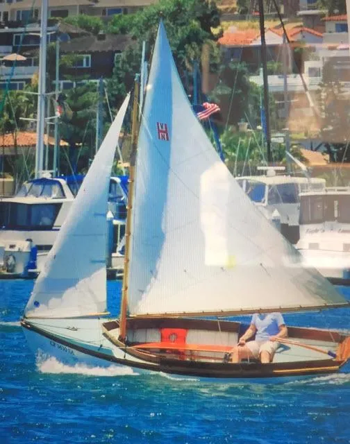 Slide: The Image of Sailboat Custom Haven 12.5 (1994) sailing in a marina with other boats in the background. - 6