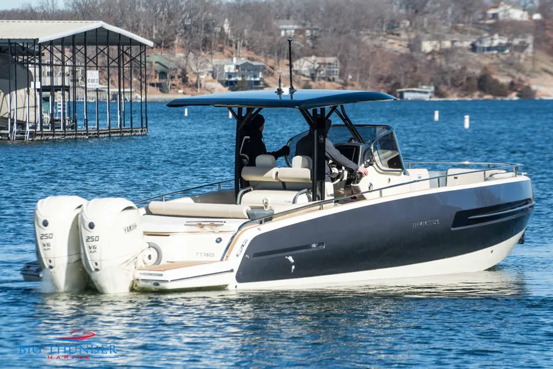 Slide: The Image of 2024 Invictus TT280S boat cruising on a lake with dual outboard engines. - 11