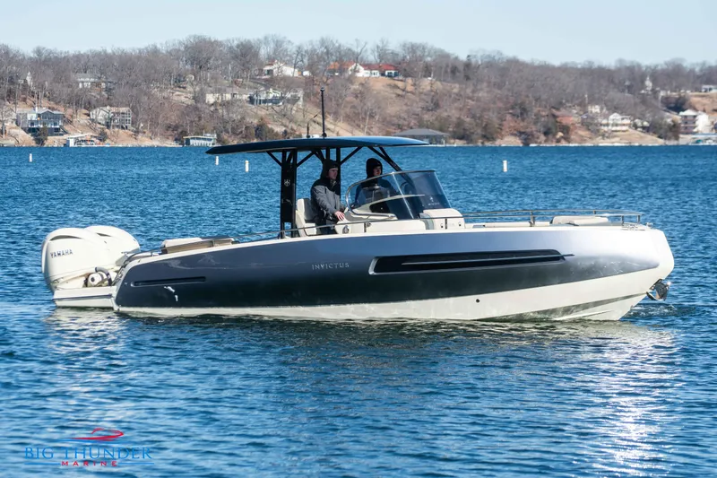Slide: The Image of 2024 Invictus TT280S motorboat cruising on a lake. - 12
