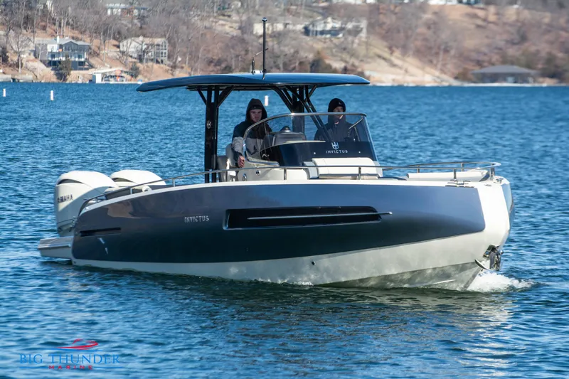 Slide: The Image of 2024 Invictus TT280S boat cruising on a lake. - 13