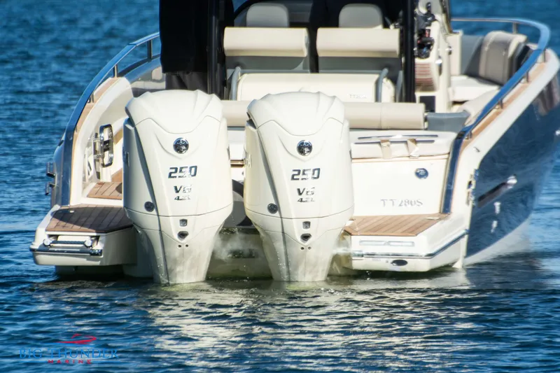 Slide: The Image of 2024 Invictus TT280S boat with twin 250 V6 engines on water. - 21