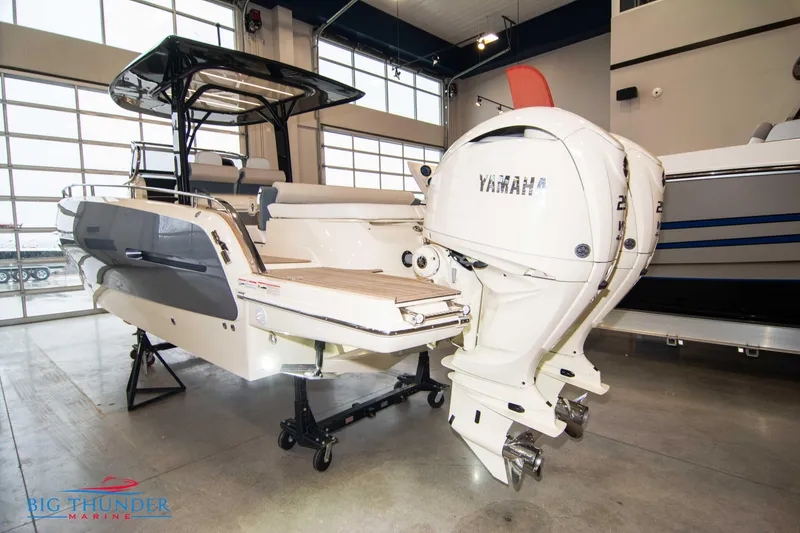 Slide: The Image of 2024 Invictus TT280S boat with dual Yamaha outboard engines in showroom. - 25