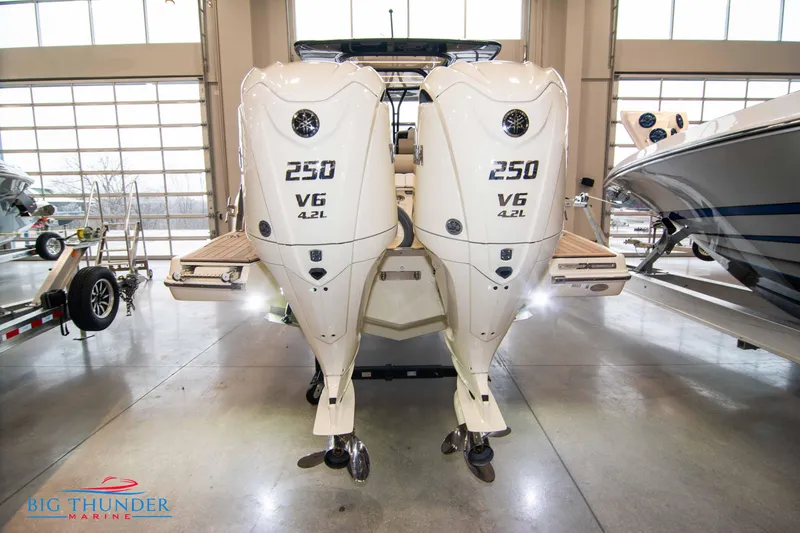 Slide: The Image of 2024 Invictus TT280S boat with twin 250 V6 4.2L engines at Big Thunder Marine showroom. - 26