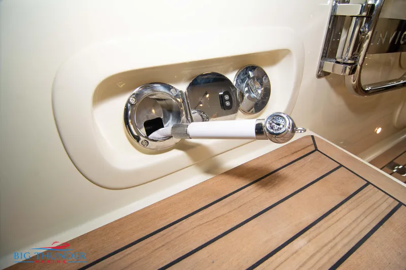 Slide: The Image of Close-up of the 2024 Invictus TT280S yacht's deck and fuel inlet. - 36