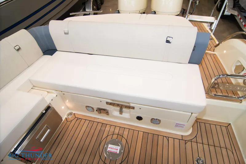 Slide: The Image of 2024 Invictus TT280S boat interior with cushioned seating and teak flooring. - 38