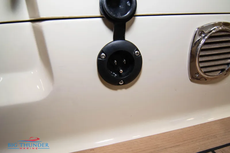 Slide: The Image of Close-up of the 2024 Invictus TT280S boat's electrical socket and vent. - 39