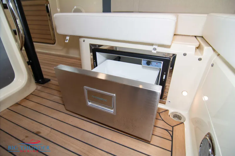 Slide: The Image of 2024 Invictus TT280S boat interior with built-in stainless steel refrigerator. - 40
