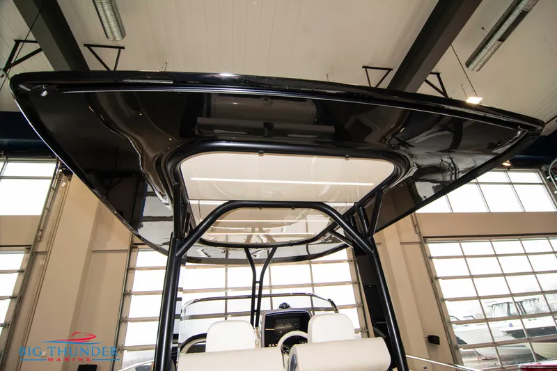 Slide: The Image of 2024 Invictus TT280S boat interior with black hardtop in showroom. - 44