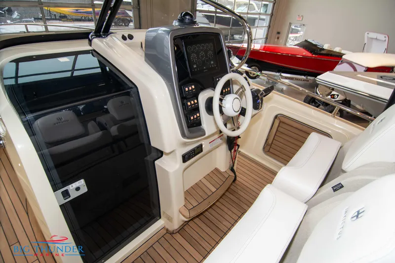 Slide: The Image of Cockpit of 2024 Invictus TT280S boat with modern controls and white seating. - 48