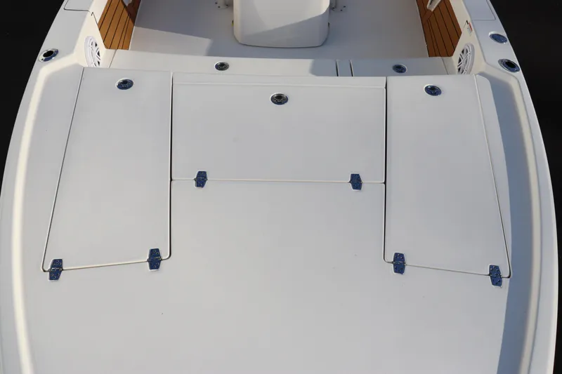 Slide: The Image of 2024 Pathfinder 2500 Hybrid boat deck with storage compartments. - 10