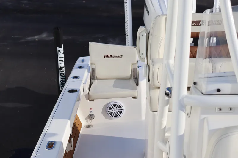 Slide: The Image of 2024 Pathfinder 2500 Hybrid boat interior with seating and speaker. - 15