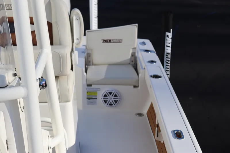 Slide: The Image of 2024 Pathfinder 2500 Hybrid boat interior with seating and speaker. - 16