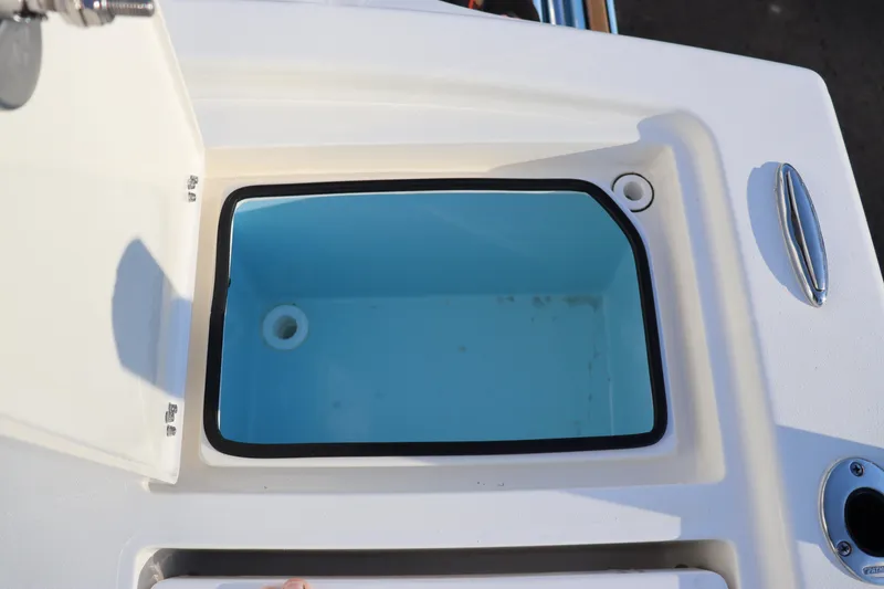Slide: The Image of Open storage compartment on 2024 Pathfinder 2500 Hybrid boat. - 20