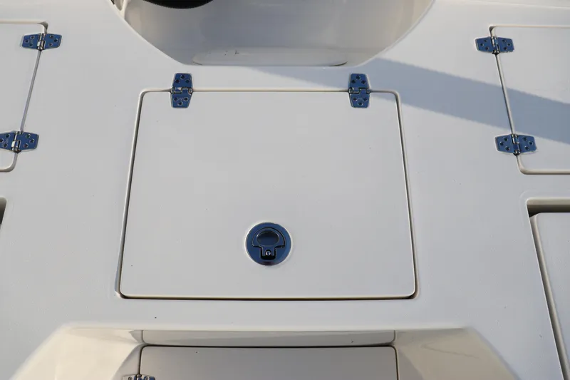 Slide: The Image of 2024 Pathfinder 2500 Hybrid boat deck with storage compartments. - 21